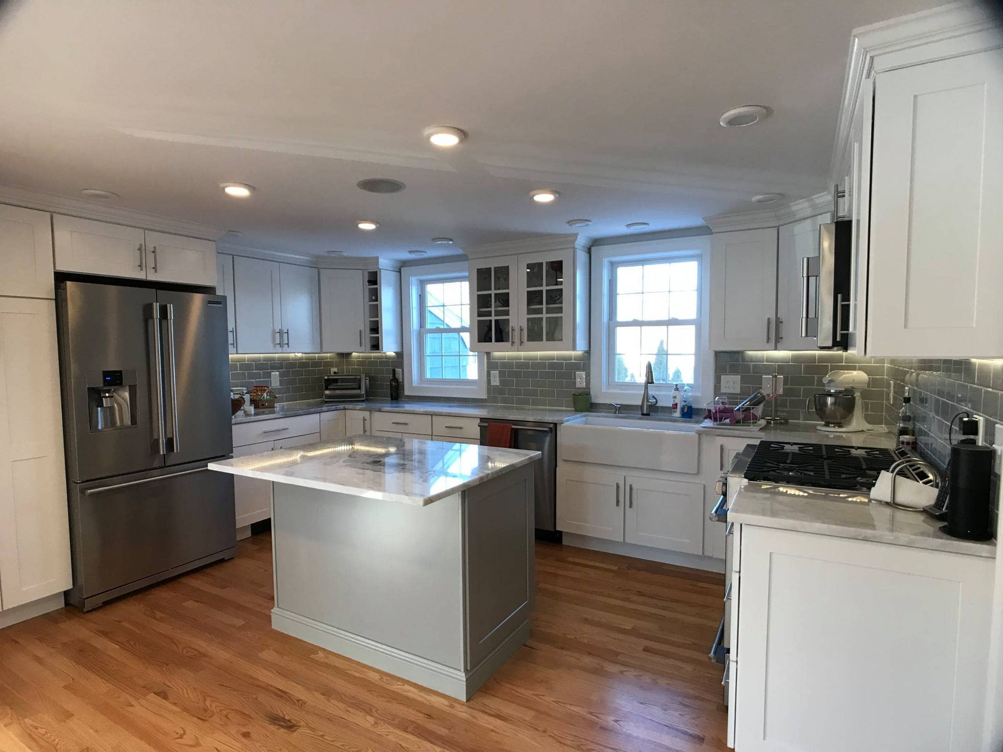 Completed white kitchen cabinets by Gallagher Painting