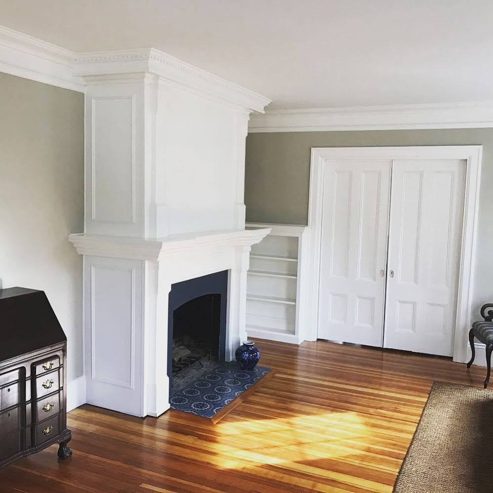 Completed bright fireplace and living space by Gallagher Painting