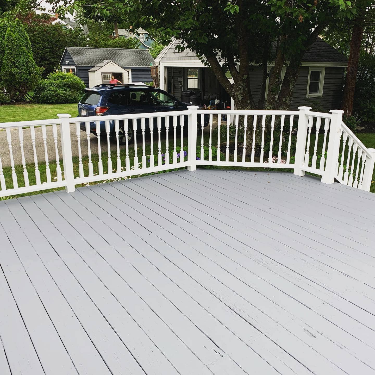 Completed painted deck and railing by Gallagher Painting