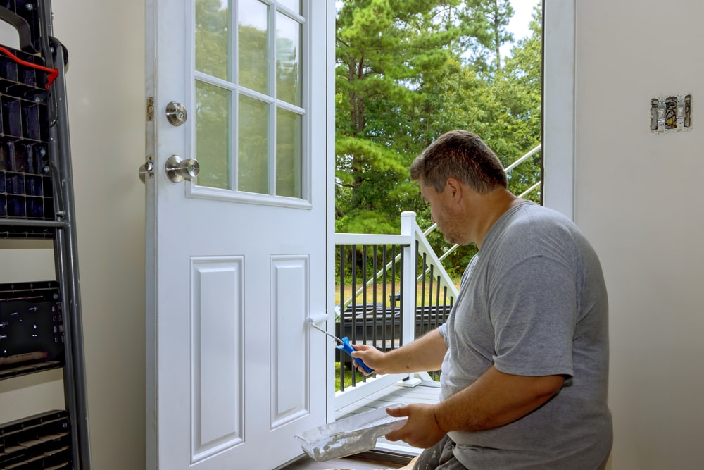 Worker Painting Front Door